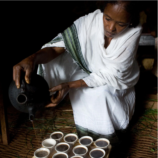 image of woman pouring Ethiopian coffee ceremony