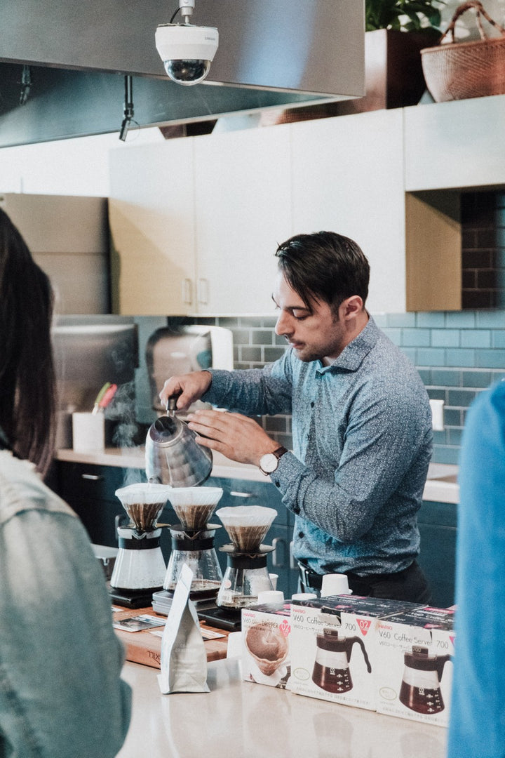 Barista demonstrating pour over at Ted X event